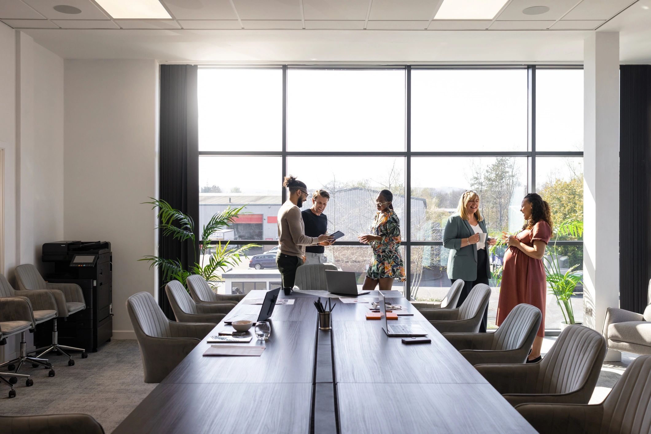 Business professionals discussing risk management strategy in a conference room